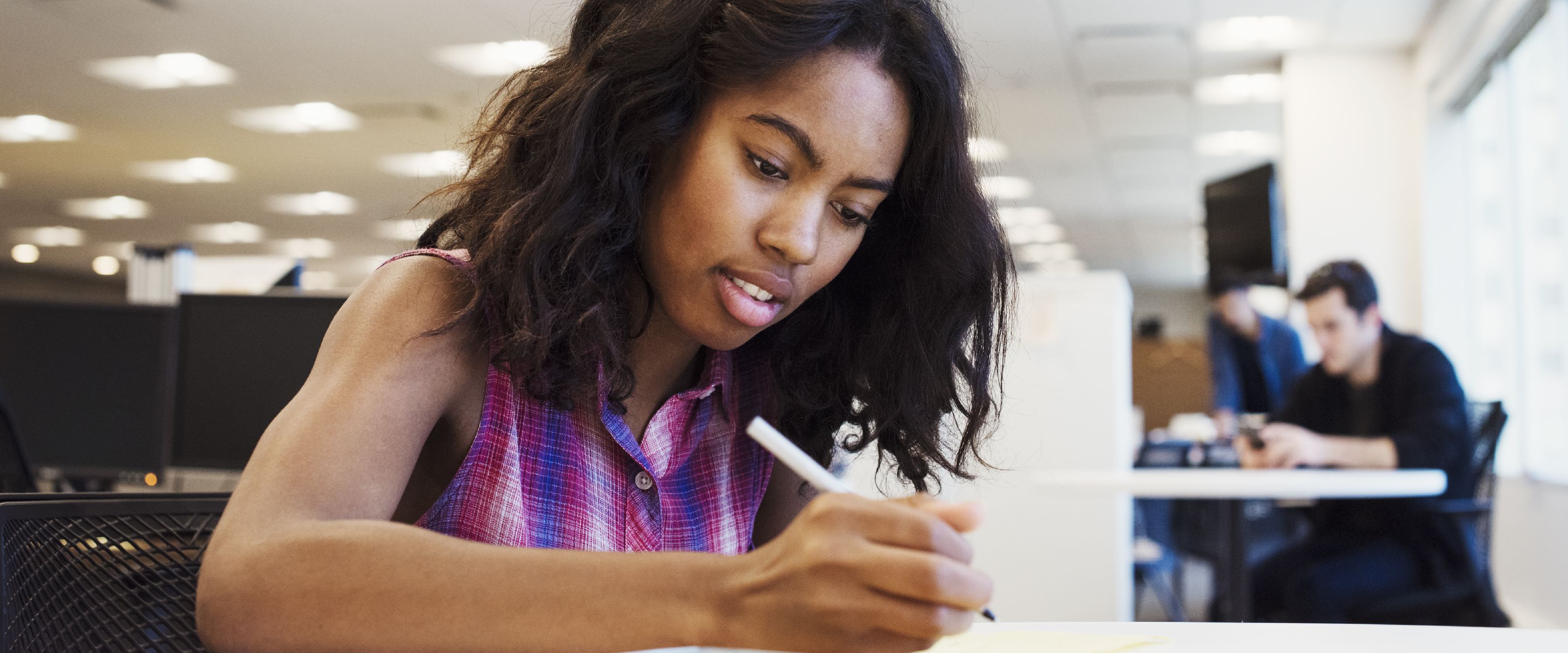 Student taking notes