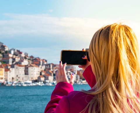 Woman taking photo with smartphone