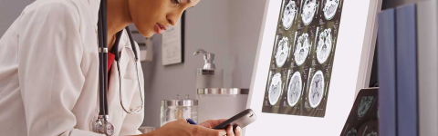 Researcher looking at smart phone
