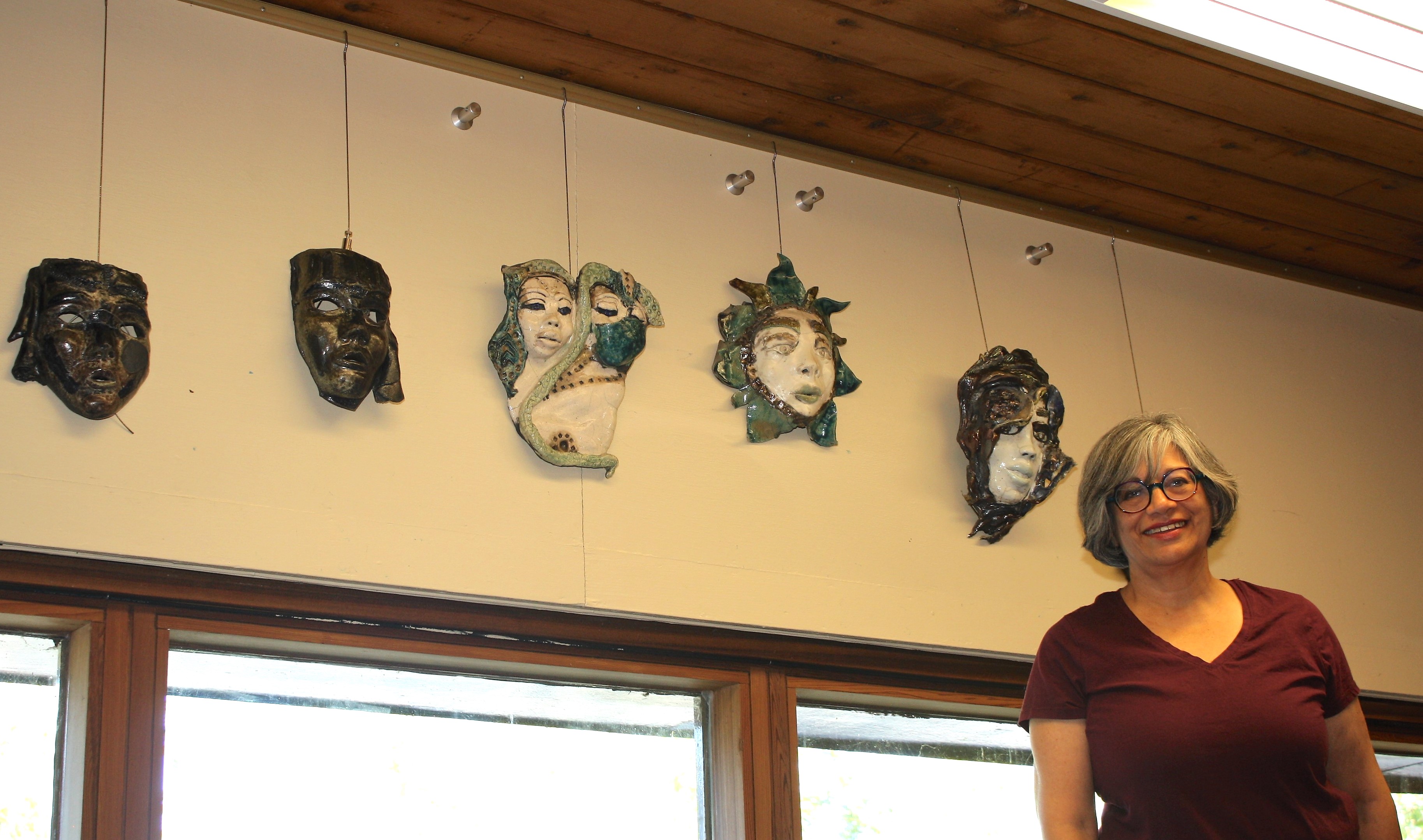 Shaheen Shariff with five artistic masks she made