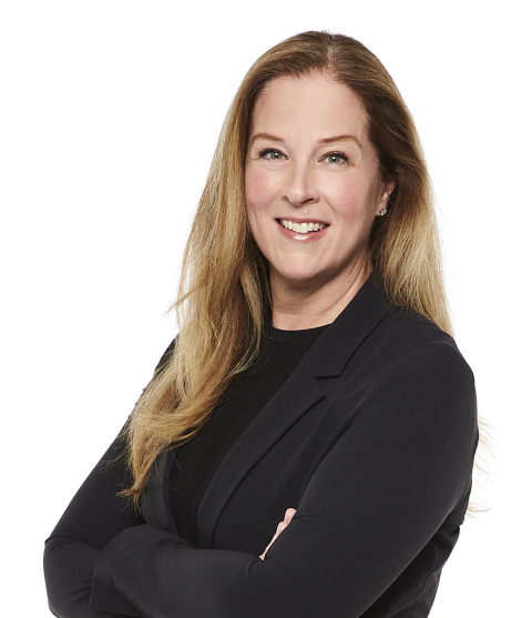 Woman with long blond hair wearing black on a white background.