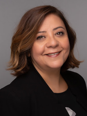 Elham Emami wearing a black blazer and black shirt