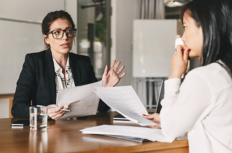 Female employee advising female student