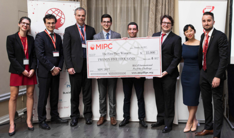 Competition organizers present the winning team from HEC Montreal with the giant cheque during the MIPC Closing Ceremony. / Photo: Edmond Chung Competition organizers present the winning team from HEC Montreal with the giant cheque during the MIPC Closing Ceremony. / Photo: Edmond Chung