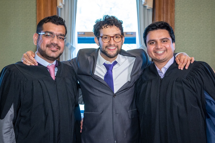 Munawar Masood, MBA’22, Professor Juan Serpa, and Hrishikesh Kulkarni, MBA’22