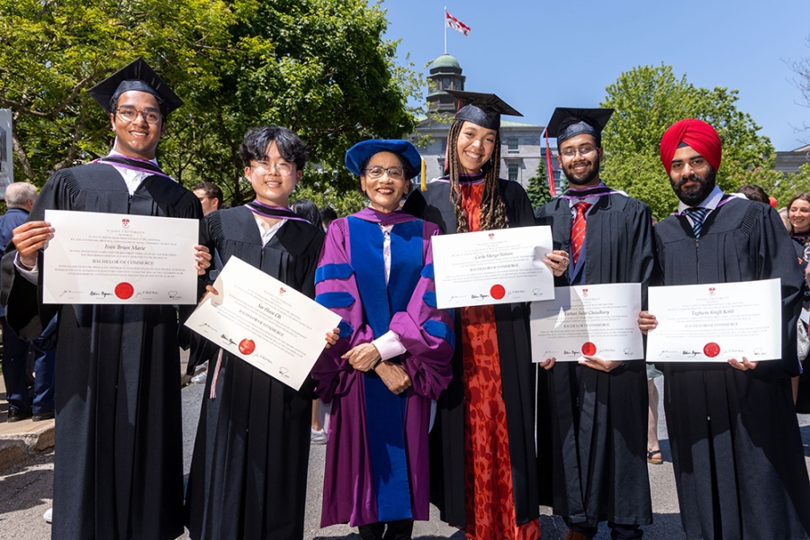 Yolande E. Chan, Dean of the Desautels Faculty of Management, with graduates of the Bachelor of Commerce (BCom) program (left to right: Ivan Marie (BCom&#039;23), Hoony Oh (BCom&#039;23), Carla Margo Nelson (BCom&#039;23), Farhan Chowdhury (BCom&#039;23), Teghwin Singh (BCom&#039;23))