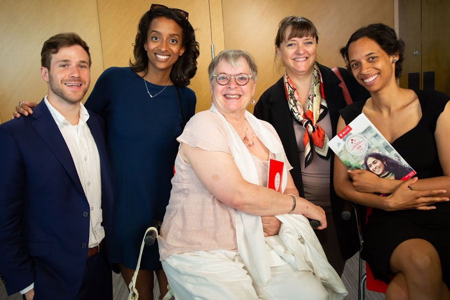 Mariama Dupuis-Sene (MBA’18), second from left, poses with family and Dean Isabelle Bajeux (second from right)