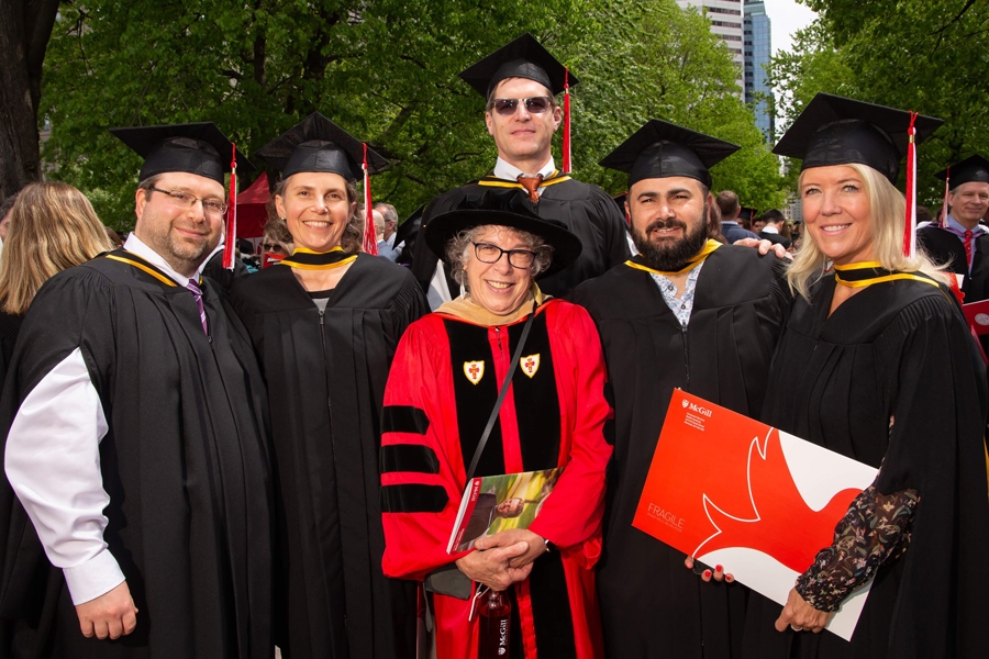 Professor Leslie Breitner and Master of Management graduates  