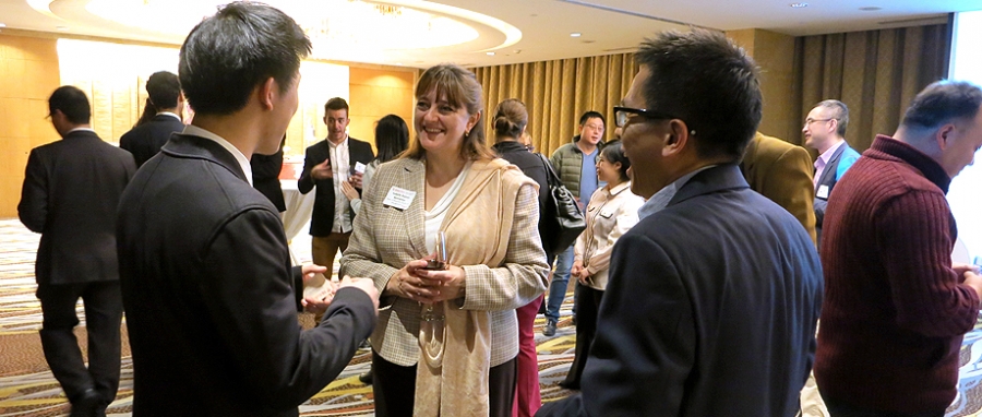 Dean Bajeux-Besnainou with current students and alumni at the Shanghai reception