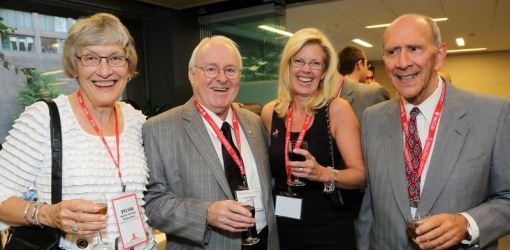 Dr. Marcel Desautels (second from left), LLD&#039;07, Desautels Faculty of Management’s largest benefactor, connects with alumni at the Dean’s Reconnect Reception.