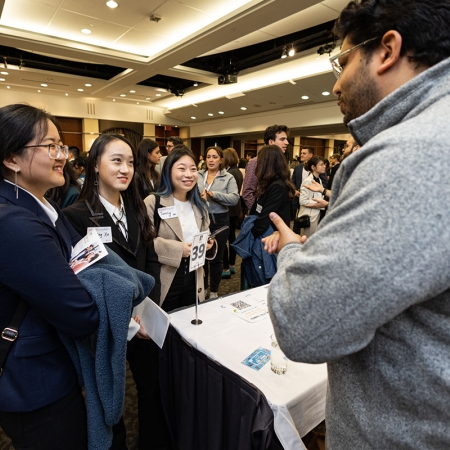 McGill students speaking with employees from Danone Canada