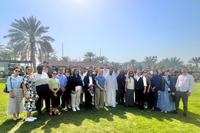 MBA Study Trip Students field palm tree