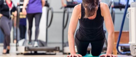 Woman with black clothes working out