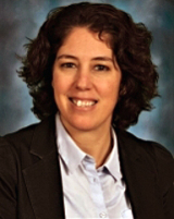 smiling lady in a white shirt and blazer