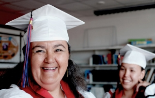 Two smiling gradutes