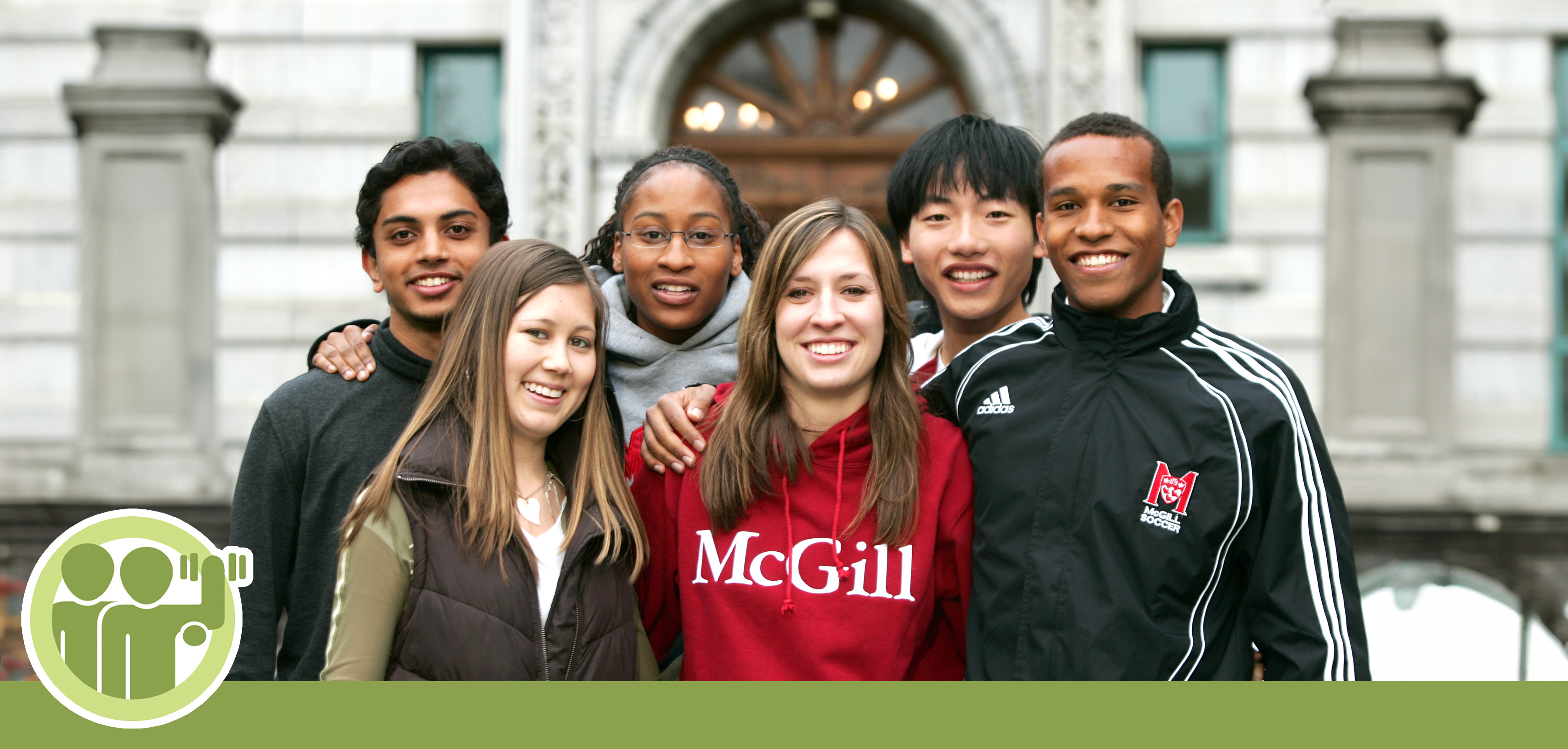 Group of student stand in front of the McGill Arts Building. One student is wearing a McGill sweatshirt.