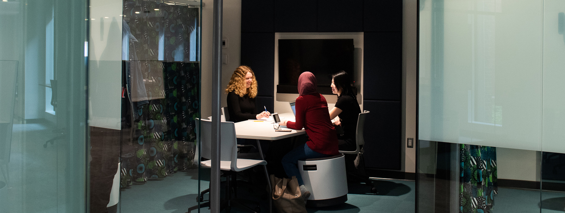 Three students at a table