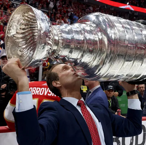 Education alumnus, Jamie Kompon, assistant coach with the Florida Panthers, kisses the Stanley Cup