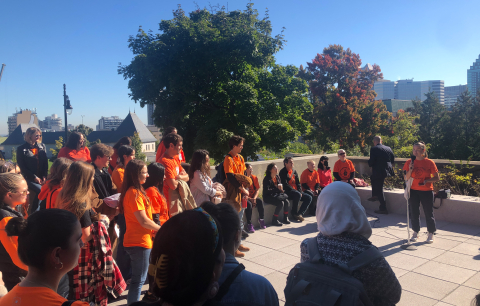 Faculty of Education members and guests gather on the Education Building terrace for We Will Walk Together ceremonies.