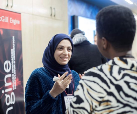 Two people talking at networking event
