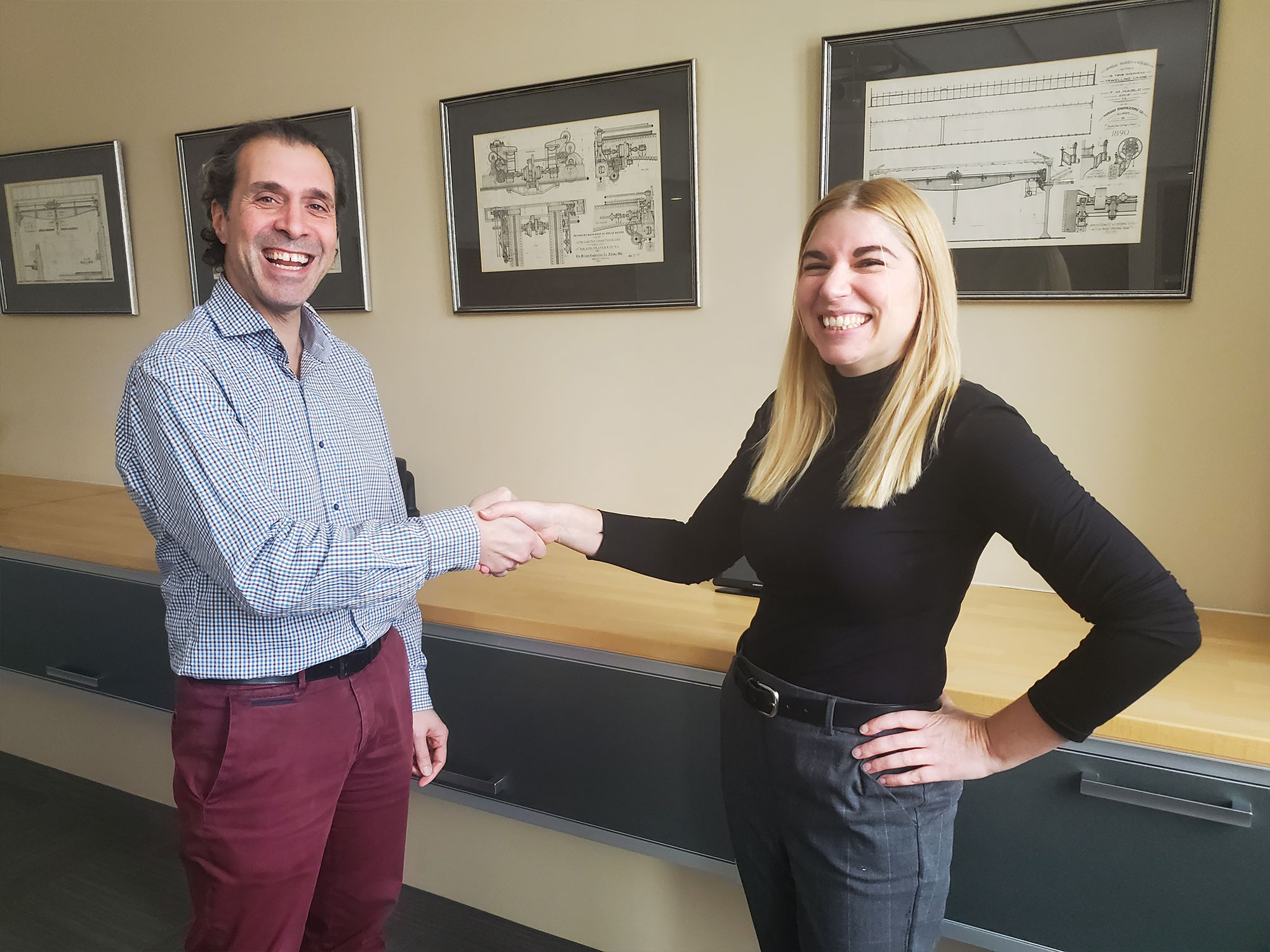 Renee Pellissier and Michael Kokkolaras shaking hands