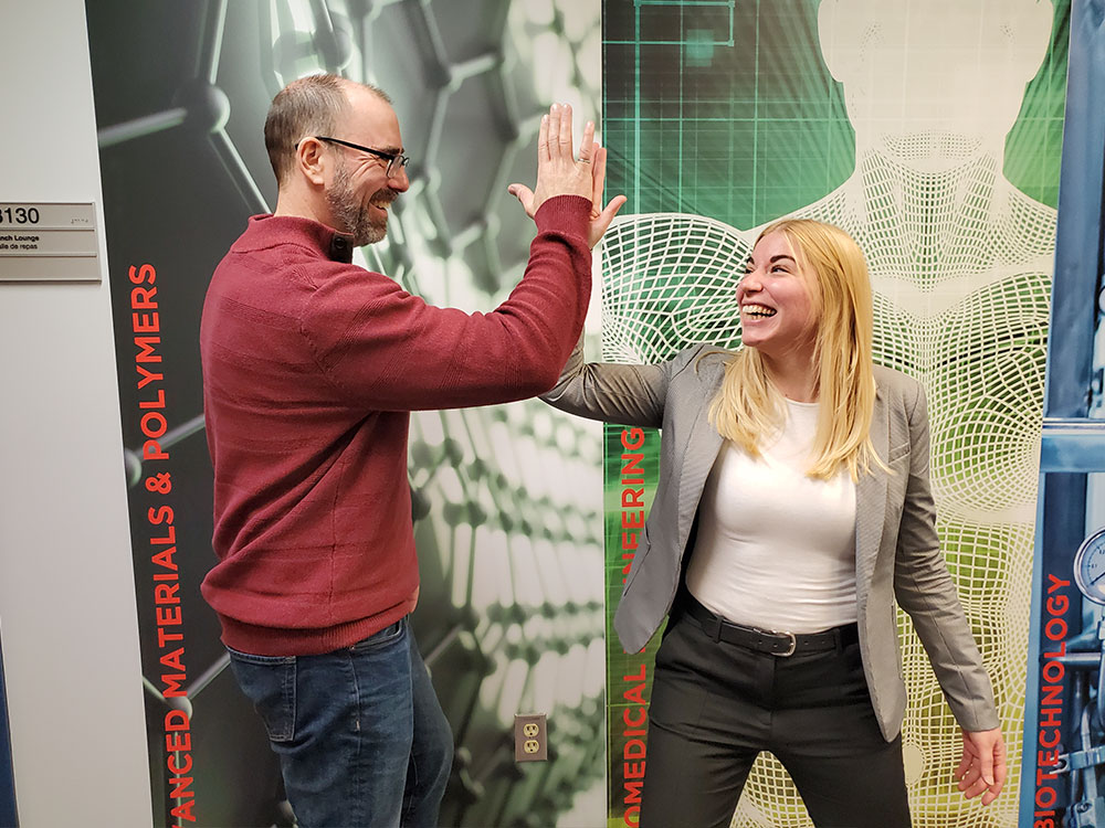 2 people high fiving