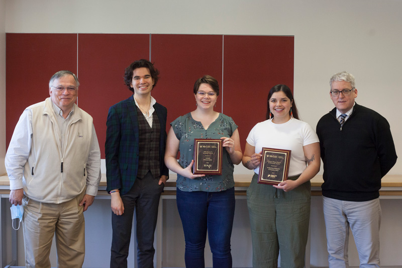 Members of IIC standing with the Dean and Associate Dean. Isabelle Prevost-Aubin and Kayleight Spencer hold one award each