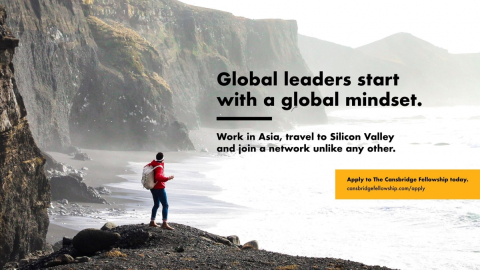 a man standing on a cliff with water and other cliffs around, with the text saying "Global leaders start with a global mindset"
