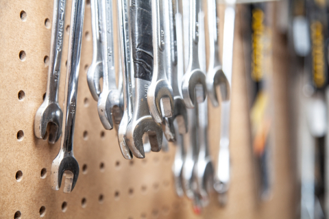 Wrenches hanging off a board