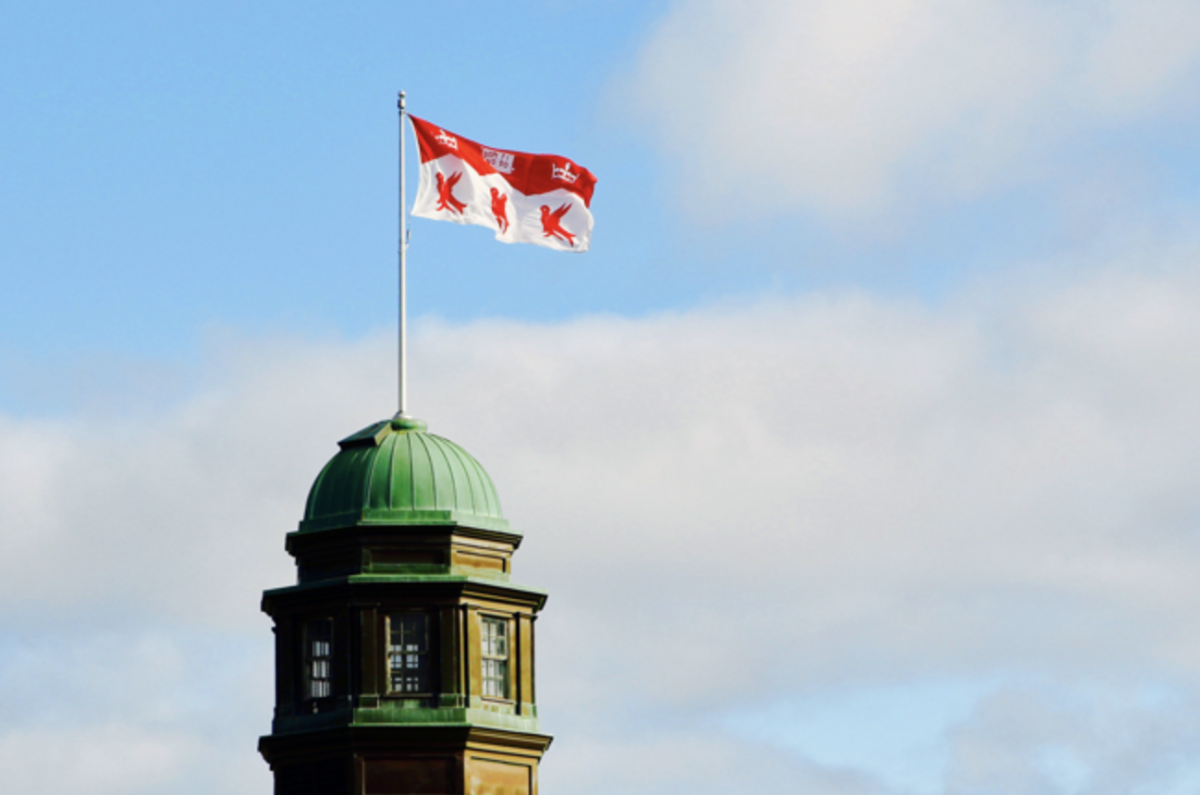 McGill University flag flying on top of Arts building