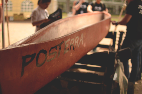 People working on a concrete canoe