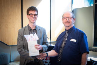2018 SURE TISED Prize winner Donovan Blais, Department of Mechanical Engineering, posing for photo with presenter