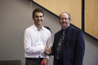 2017 SURE Faculty Prize winner Jonathan Arsenault, Department of Mechanical Engineering, posing for photo with presenter