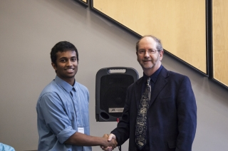 2017 SURE Faculty Prize winner Vishesh Pradeep, Department of Mechanical Engineering, posing for photo with presenter