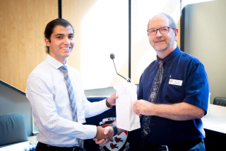 2018 SURE Faculty Prize winner Abtin Ameri, posing for photo with presenter