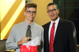 2016 SURE Faculty Prize winner Corey Miles,  Department of Mechanical Engineering, posing for photo with presenter