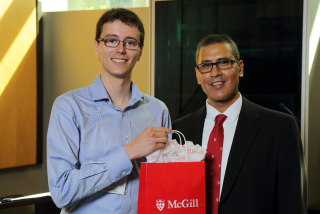 2016 SURE Faculty Prize winner Dylan Caverly,  Department of Mechanical Engineering, posing for photo with presenter