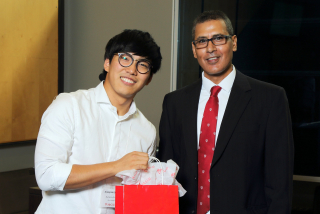 2016 SURE Faculty Prize winner Kyungmin John Jung,  Department of Mechanical Engineering, posing for photo with presenter