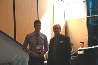 2019 SURE Faculty Prize winner Noah Ferravotto, Department of Mechanical Engineering, posing for photo with presenter