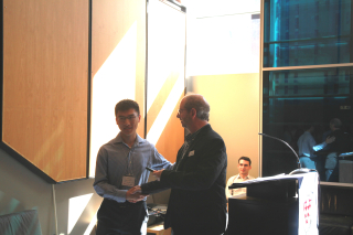 2019 SURE Faculty Prize winner Oliver Xie, Department of Chemical Engineering, posing for photo with presenter