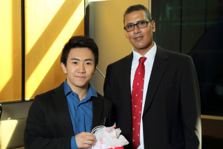 2016 SURE TISED Prize winner Oscar Ng,  Department of Mechanical Engineering, posing for photo with presenter