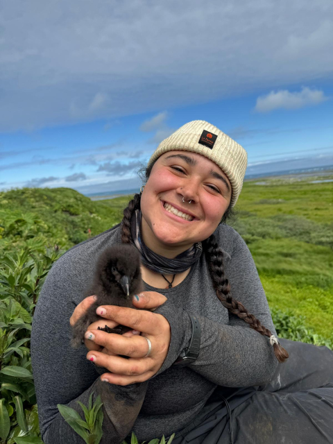 Cassandra Ciafro hold a baby bird