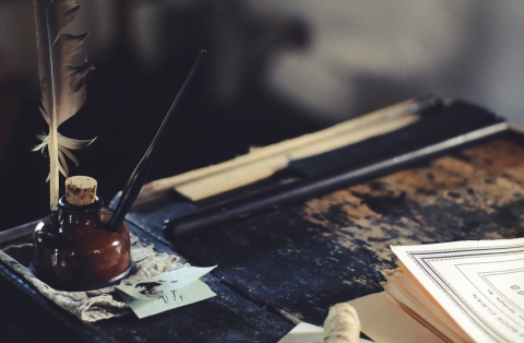 Quill in inkpot