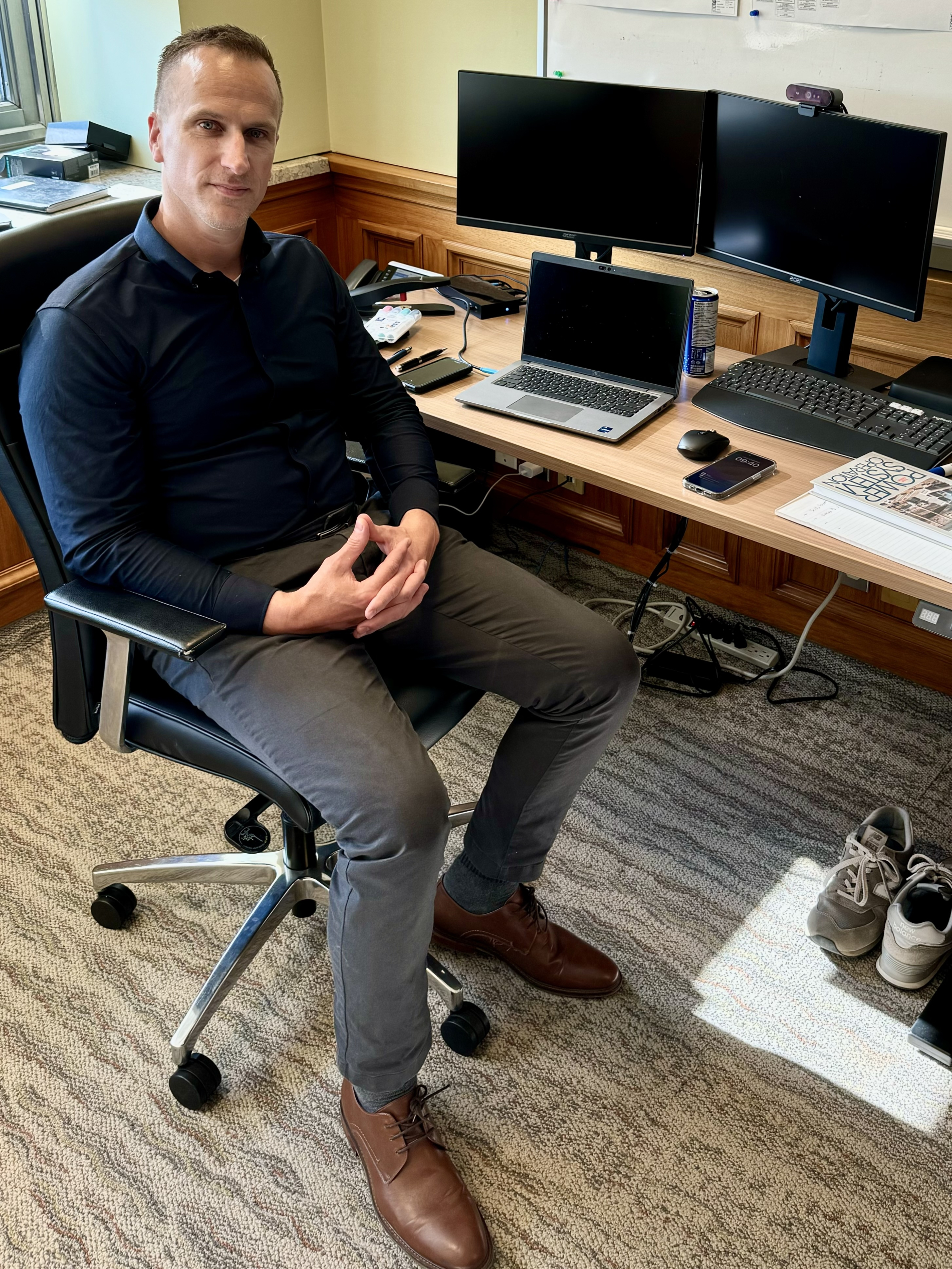 Joël Thibert sits at his desk in his Montreal office. 