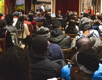 A room full of various Black people at an event 