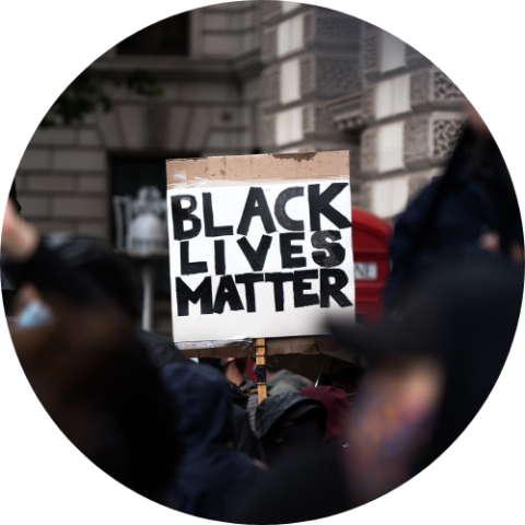 Protestor holding a sign saying Black Lives Matter