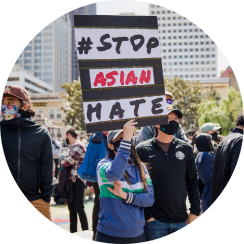 Protester holding a sign saying #StopAsianHate