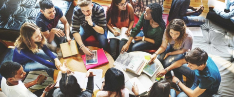 Diverse group of students working at a table 