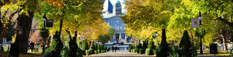 McGill's Arts Building with Autumn trees surrounding it