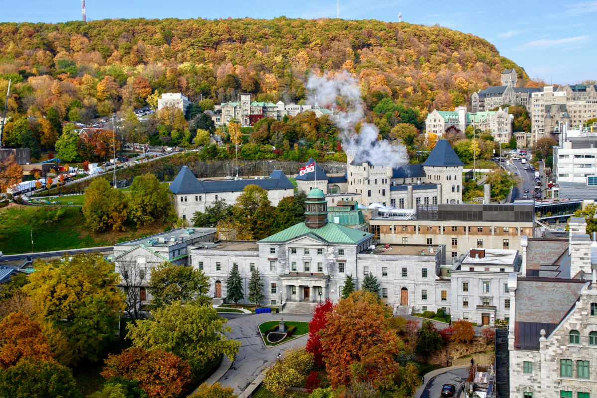 Aerial view of the downtown campus with the Arts Building in the centre and Mont Royal in the background